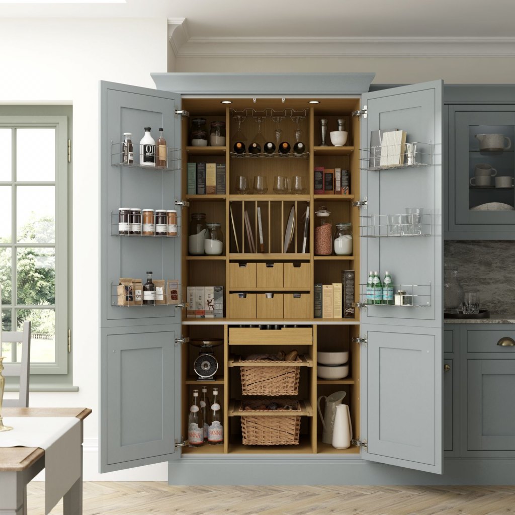 a pale blue kitchen with a classic kitchen pantry within it. A selection of kitchenware is shown within the pantry
