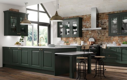 Dark green kitchen with white worktops, showing an island and breakfast bar with units along the wall